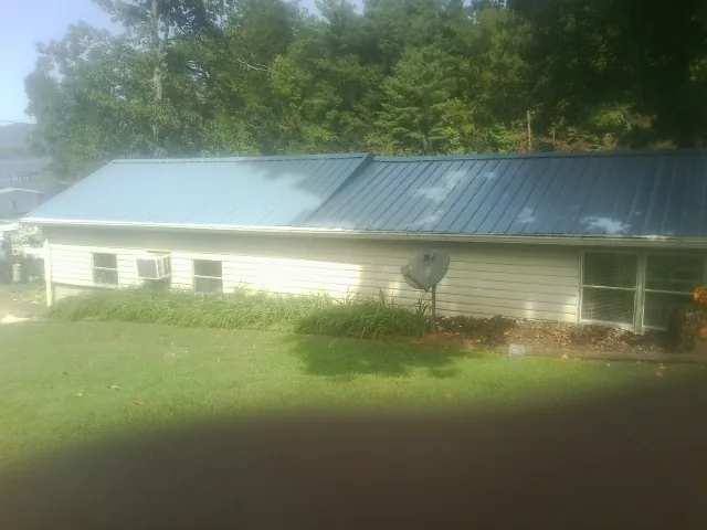 Blue metal roof running the length of a single story home in Rocky River